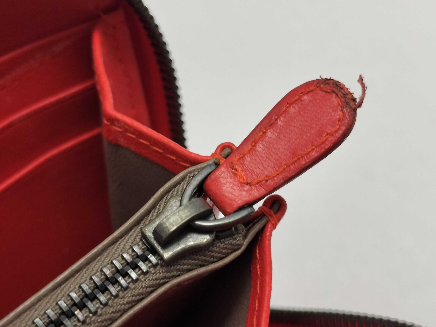 BOTTEGA VENETA Intrecciato Leather Long Wallet with Zip-Around Design, Orange