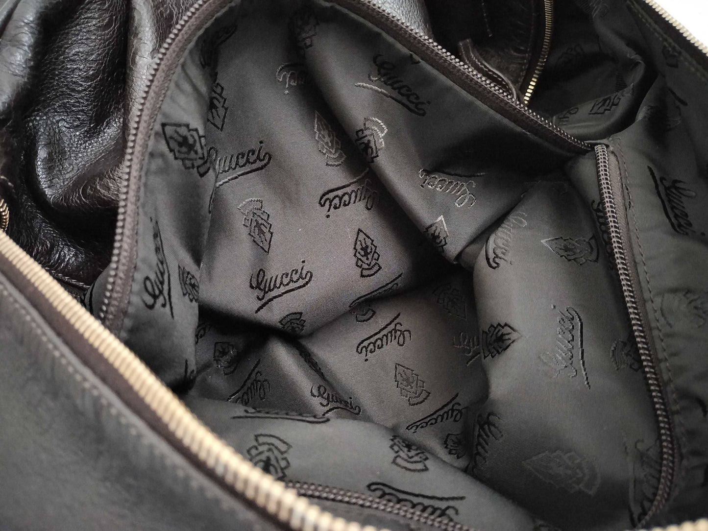 GUCCI Guccissima 2-way Boston bag with GG pattern and 206500 leather.