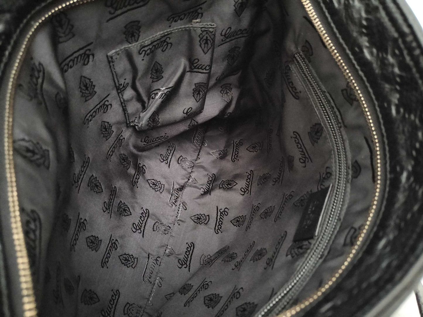 GUCCI Guccissima Leather Shoulder Bag with GG Pattern and Logo Plate 201446