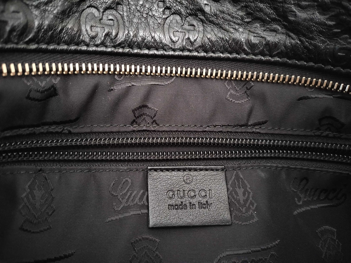 GUCCI Guccissima Leather Shoulder Bag with GG Pattern and Logo Plate 201446