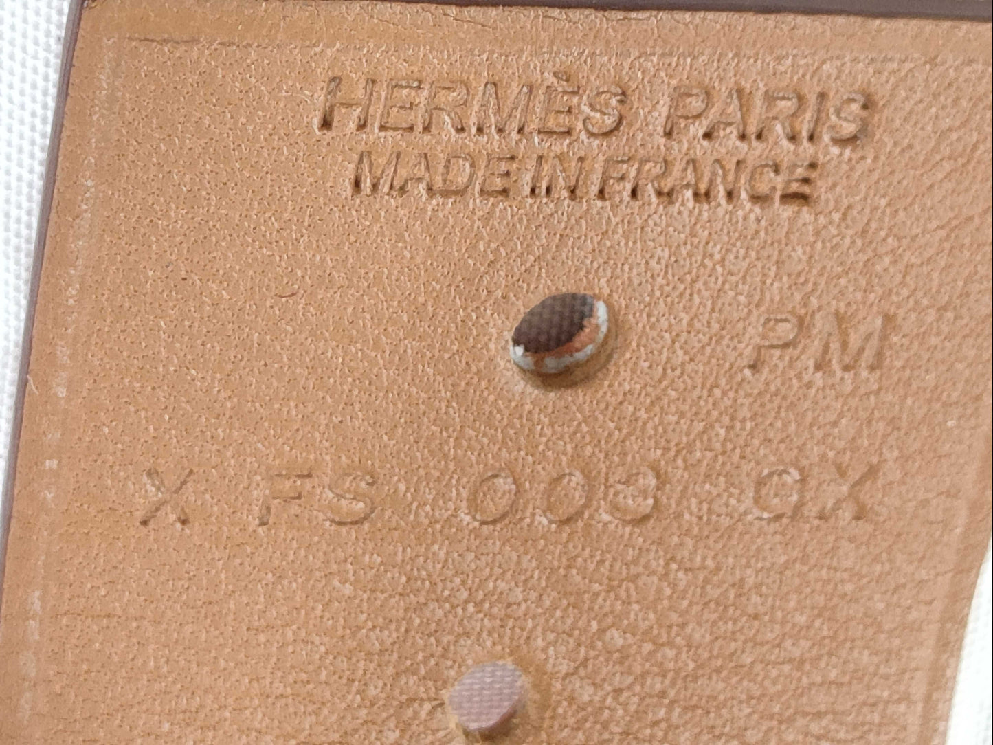 HERMES engraved X Hermes Medor X engraved PM bracelet with metal film.