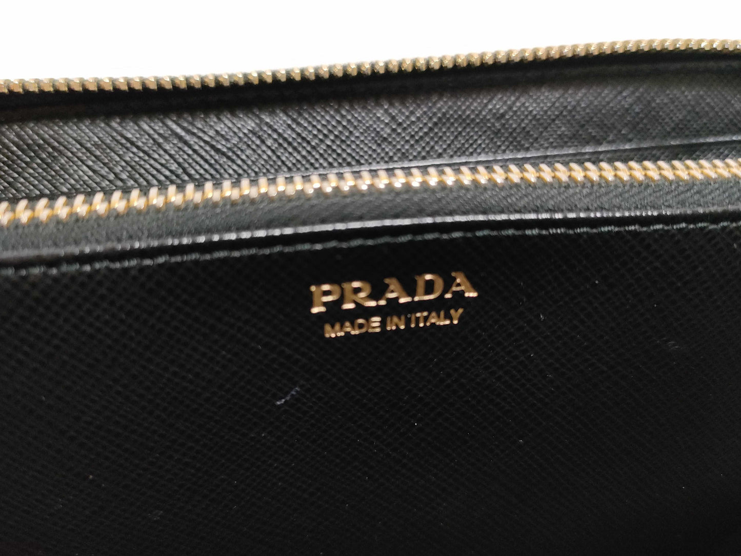 PRADA Saffiano Round Zippy Logo Wallet