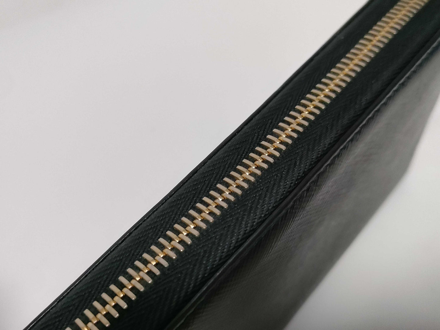 PRADA Saffiano Round Zippy Logo Wallet