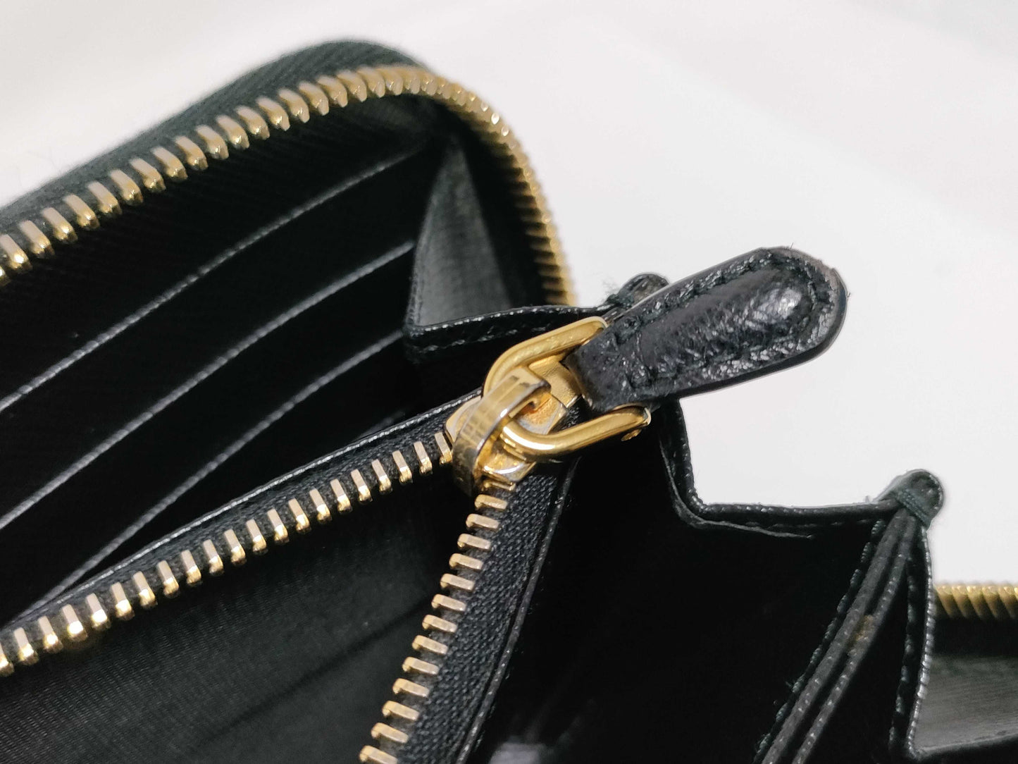 PRADA Saffiano Round Zippy Logo Wallet