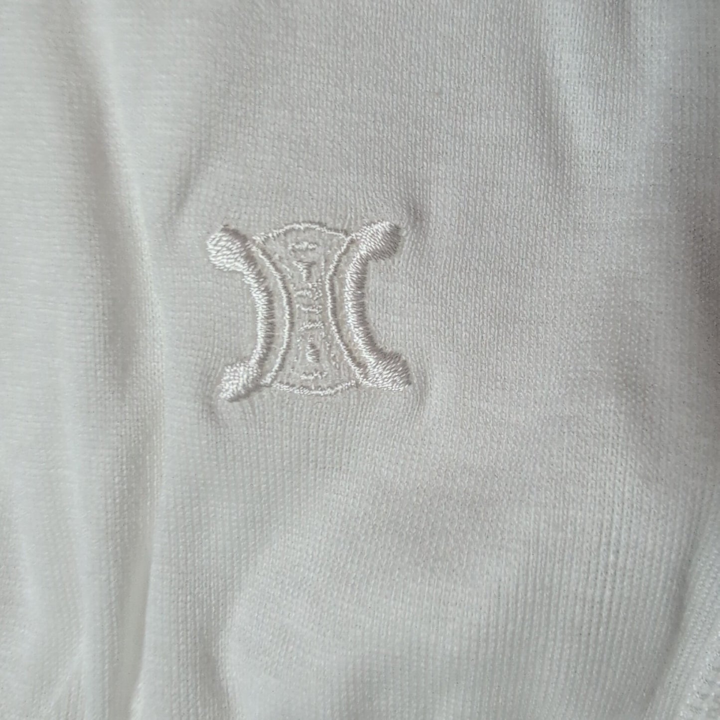 CELINE Brand new, unused cotton pants with a single Triomphe logo in white.