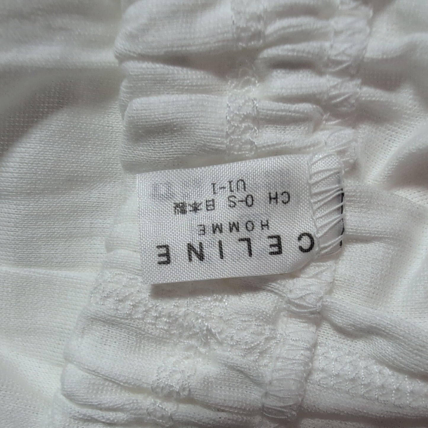 CELINE Brand new, unused cotton pants with a single Triomphe logo in white.