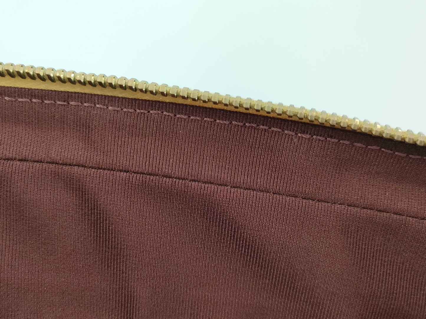 CHANEL V-stitch black and gold bag