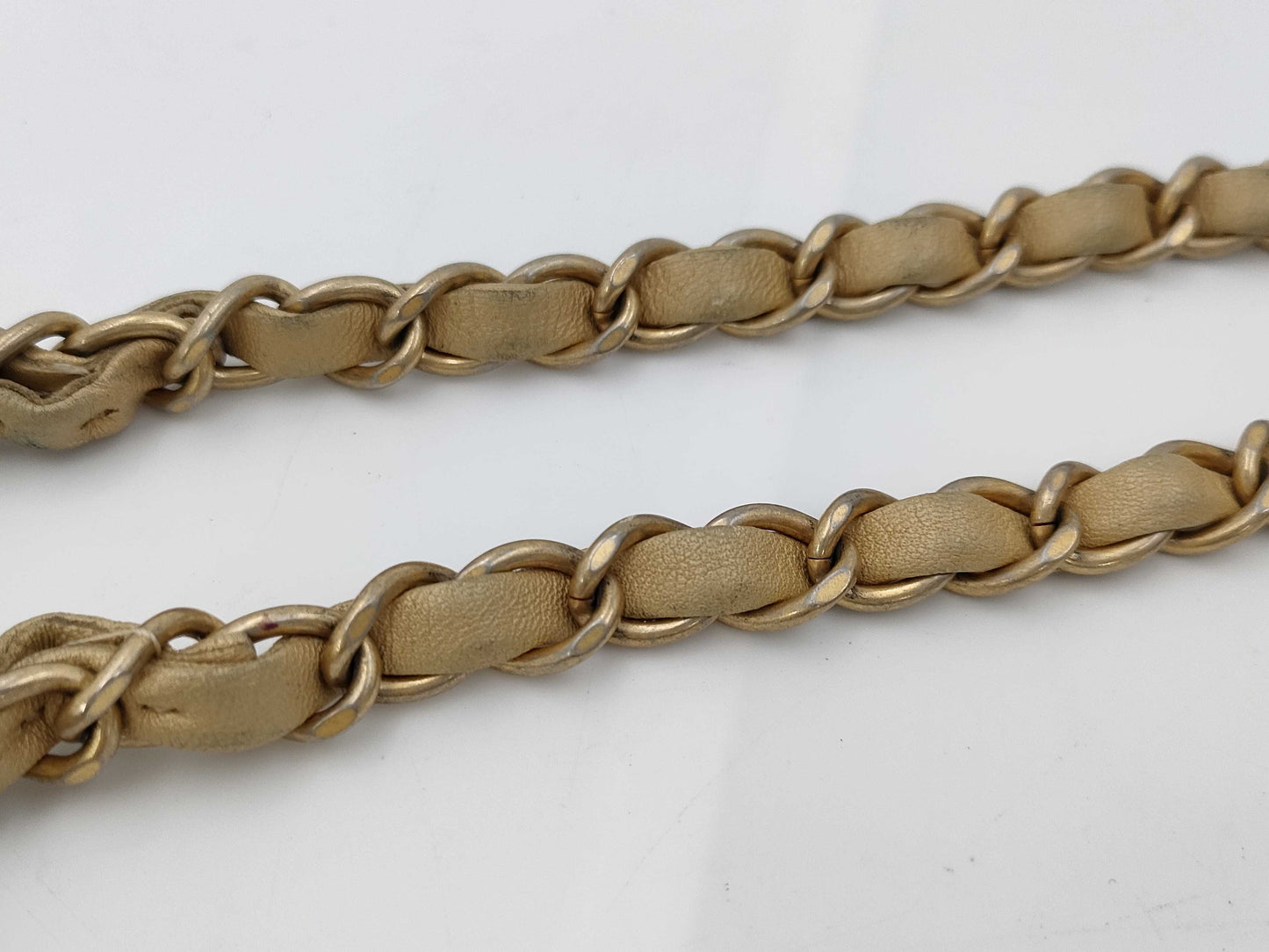 CHANEL V-stitch black and gold bag
