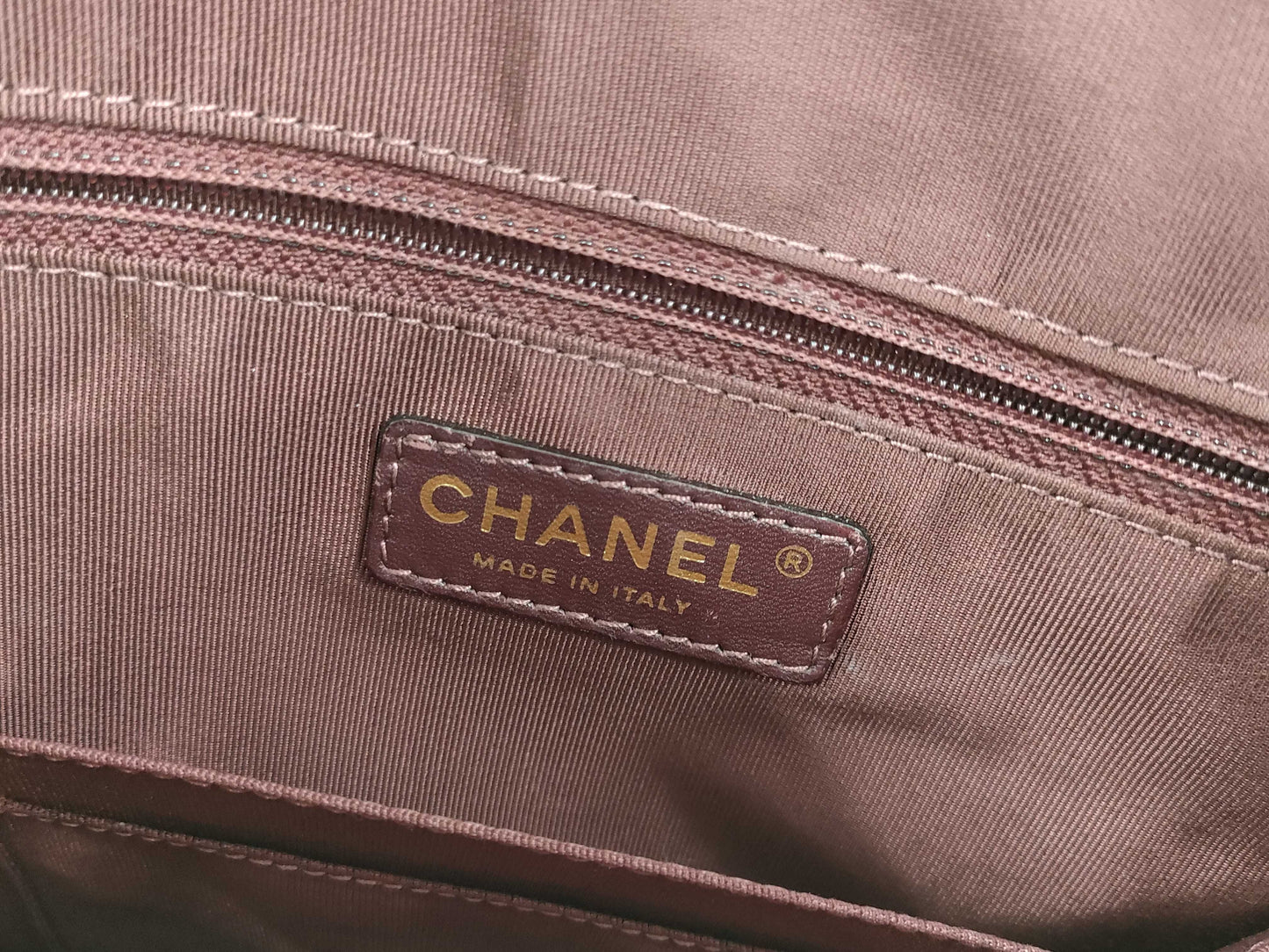 CHANEL V-stitch black and gold bag