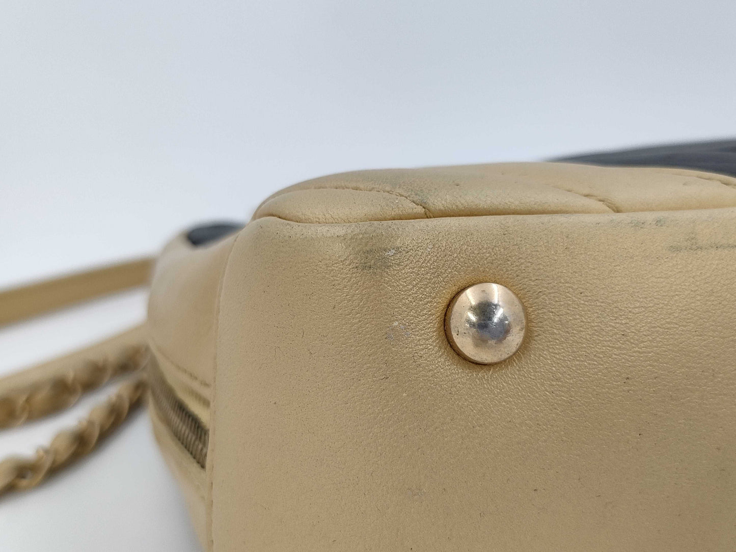 CHANEL V-stitch black and gold bag