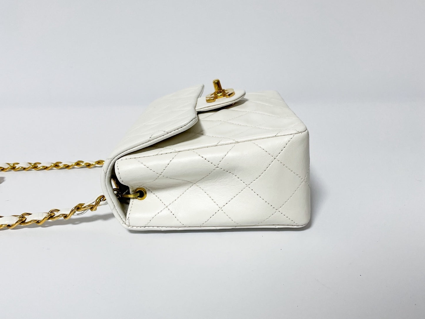 CHANEL Mini Matelasse White Lambskin Shoulder Bag with Seal