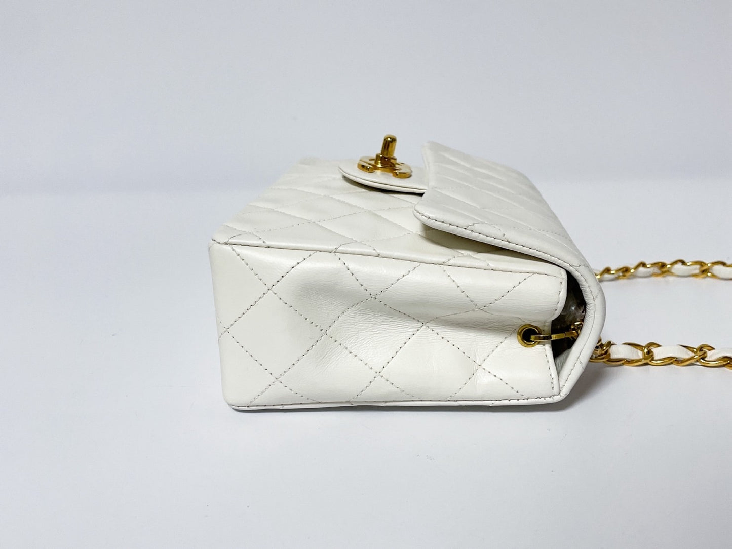 CHANEL Mini Matelasse White Lambskin Shoulder Bag with Seal