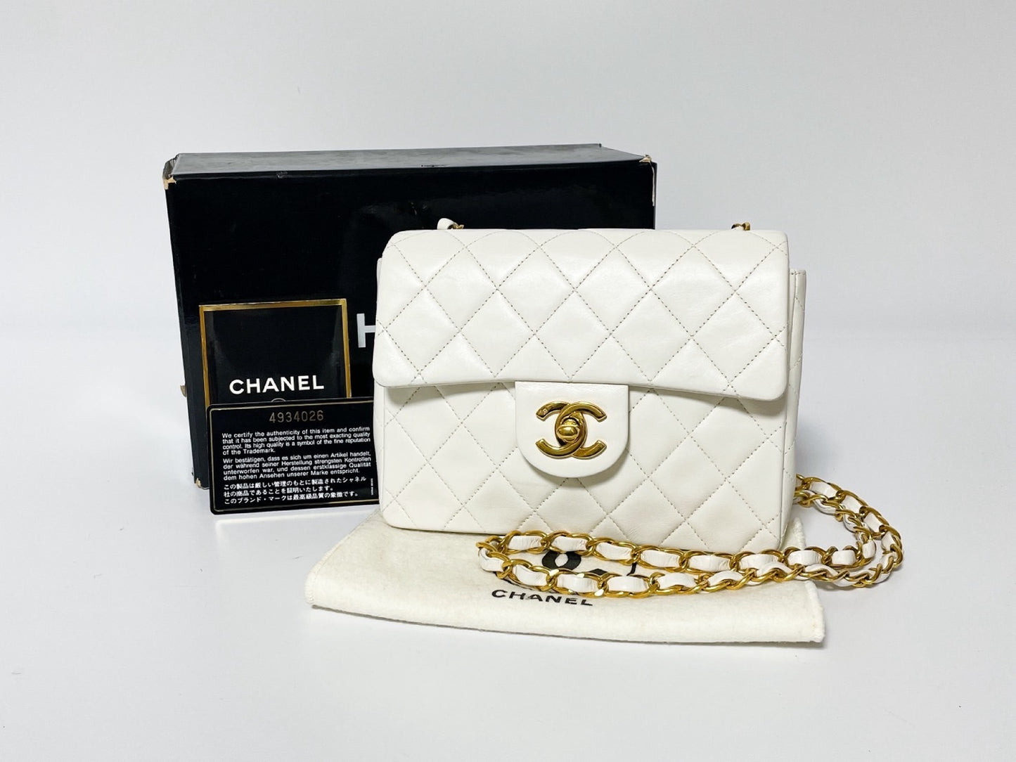 CHANEL Mini Matelasse White Lambskin Shoulder Bag with Seal