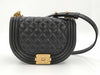 CHANEL Boy Chanel Round Caviar Leather Shoulder Bag with Gold Hardware and Chain Serial Number Plate in Black