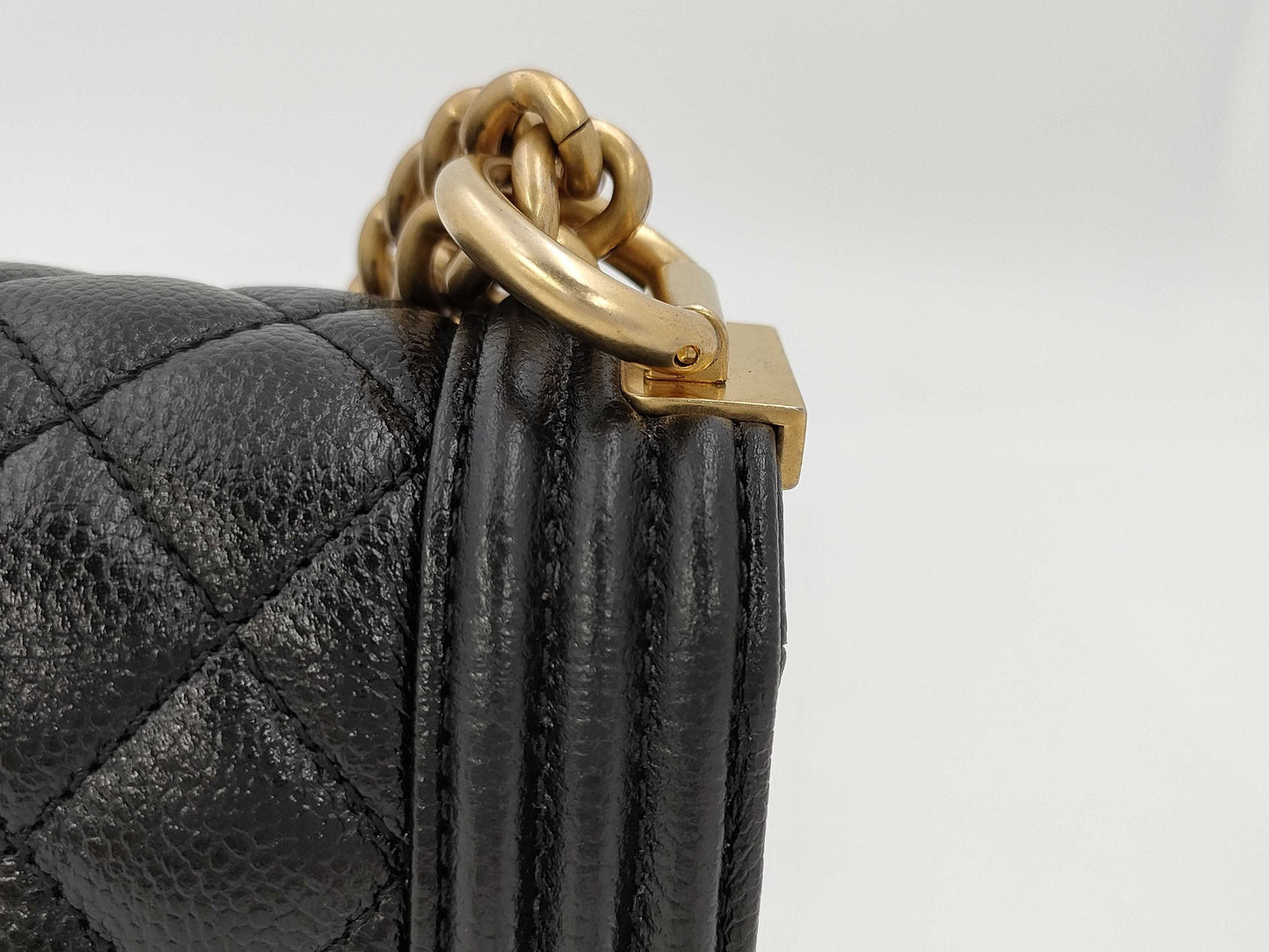 CHANEL Boy Chanel Round Caviar Leather Shoulder Bag with Gold Hardware and Chain Serial Number Plate in Black