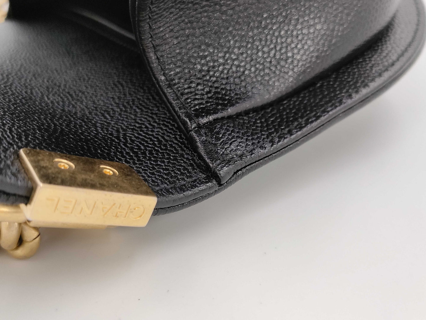 CHANEL Boy Chanel Round Caviar Leather Shoulder Bag with Gold Hardware and Chain Serial Number Plate in Black