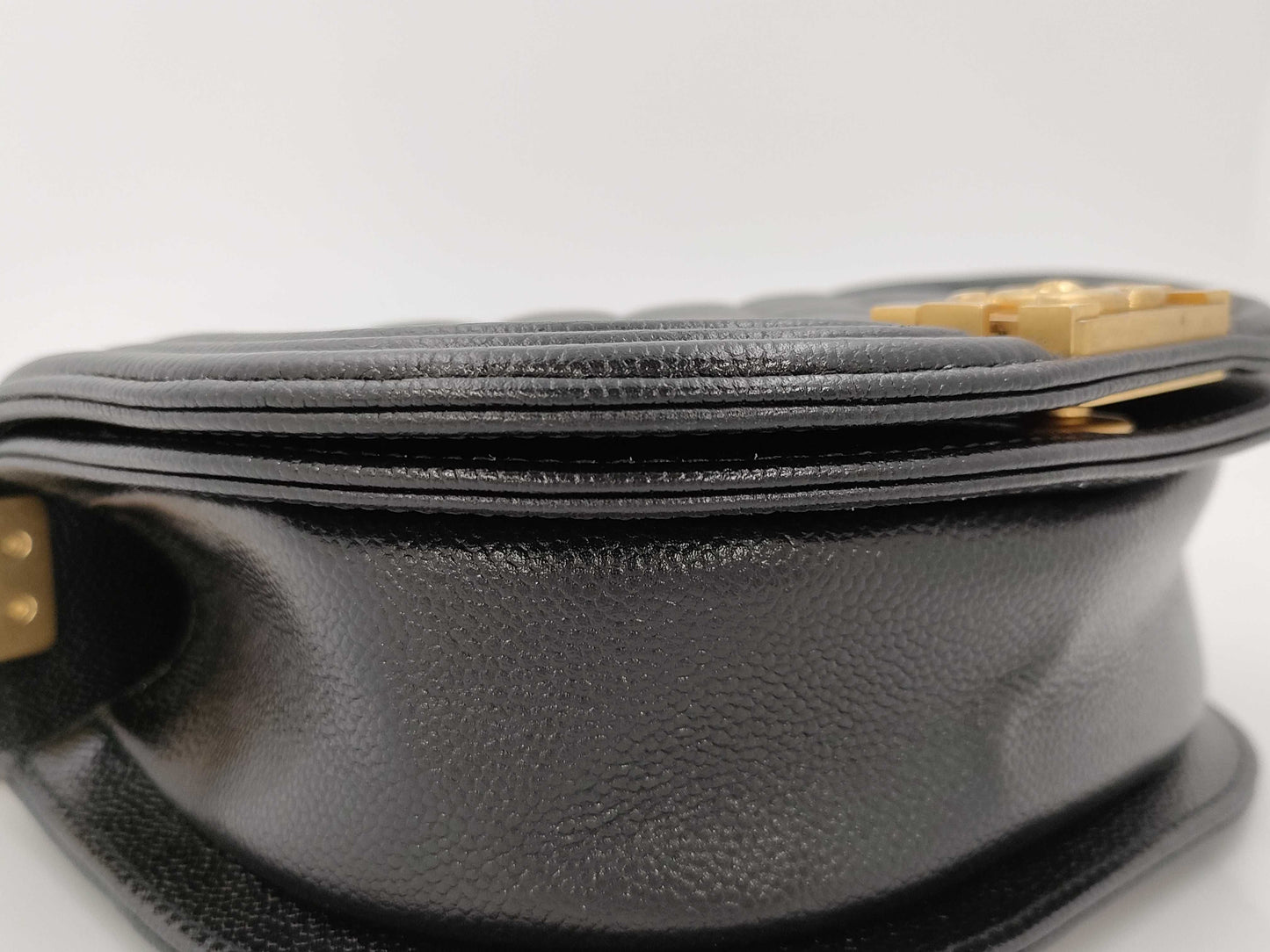 CHANEL Boy Chanel Round Caviar Leather Shoulder Bag with Gold Hardware and Chain Serial Number Plate in Black