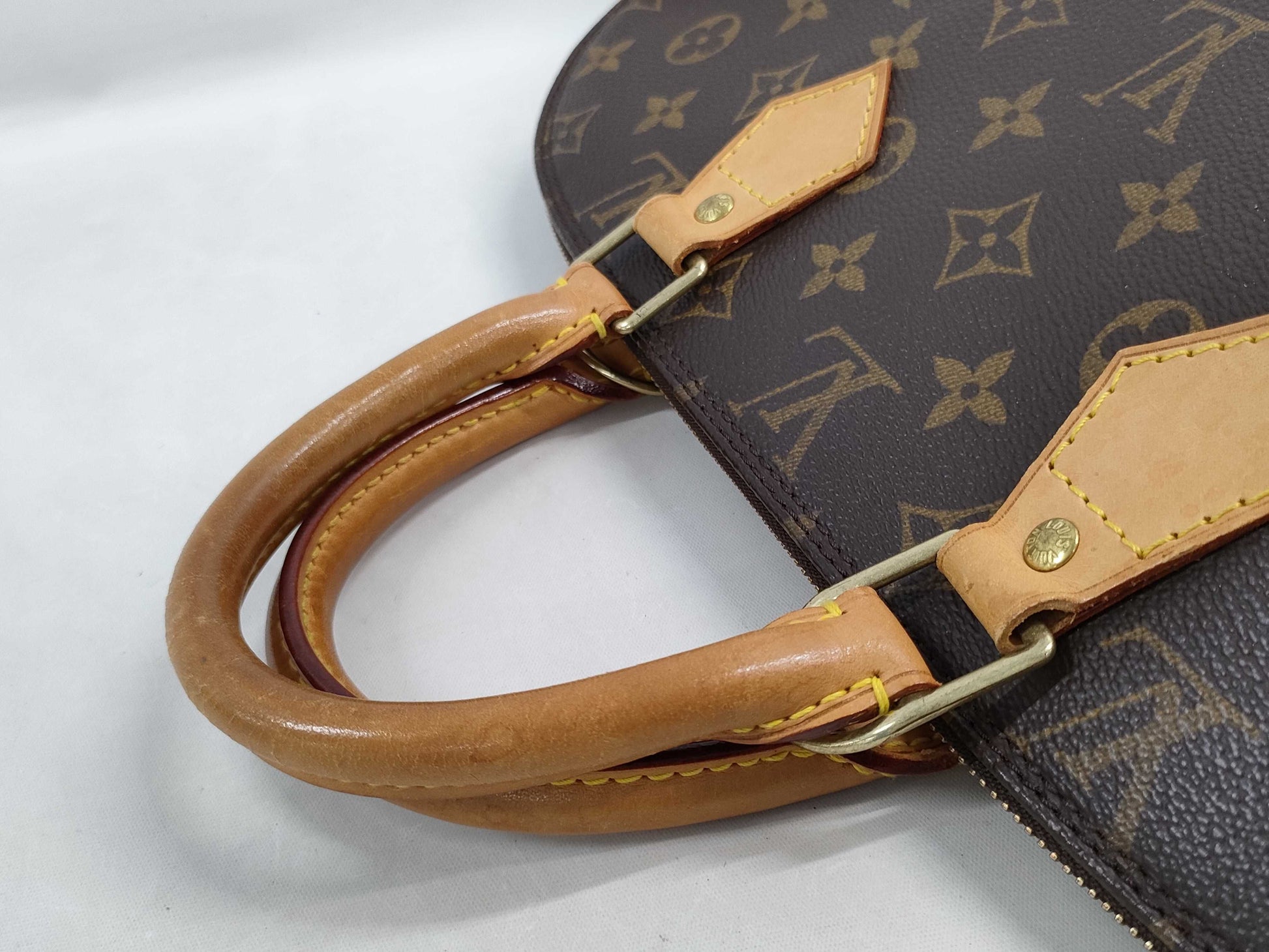 LOUIS VUITTON Monogram Alma Handbag