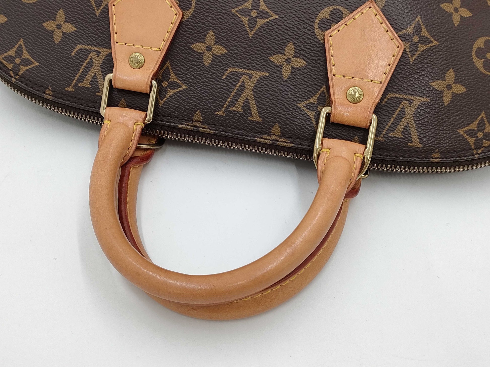 LOUIS VUITTON Monogram Alma Handbag