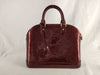 LOUIS VUITTON Louis Vuitton Enamel Alma BB Handbag