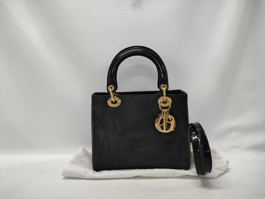 Dior Lady Dior Suede Black Handbag with dust bag and shoulder strap.