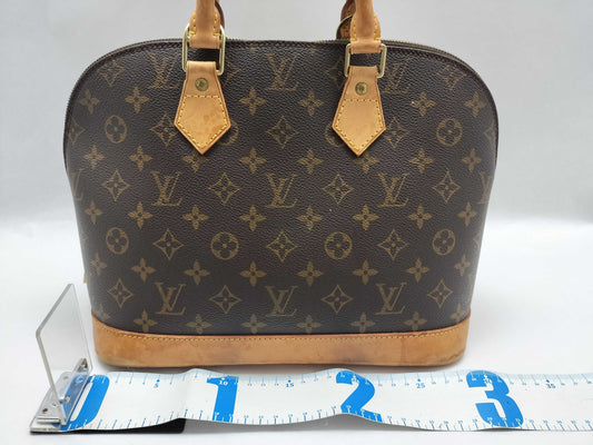 LOUIS VUITTON Monogram Alma Handbag