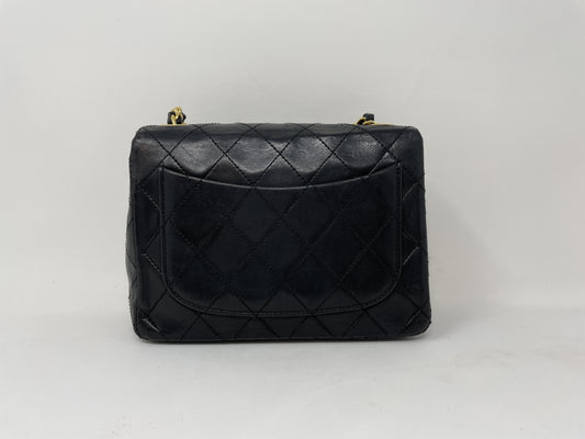 CHANEL CHANEL Mini Matelasse Shoulder Bag with Gold Hardware, Coco Mark, and Turn Lock