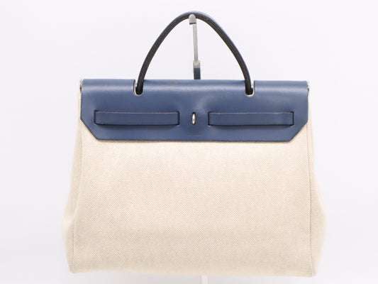 HERMES Leather Air Bag PM Shoulder Bag with Shoulder Strap, Padlock, 2 Keys, Cloche, and Dust Bag. Navy and White.