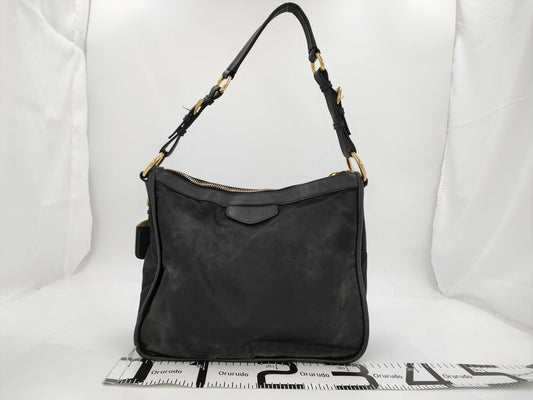 PRADA Tessuto nylon and leather one-shoulder bag with name tag