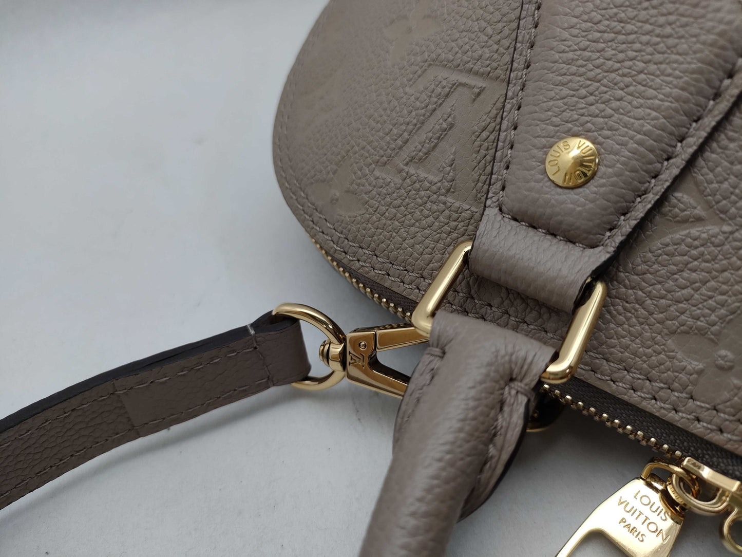 LOUIS VUITTON Monogram Empreinte Louis Vuitton Neo Alma Empreinte Handbag