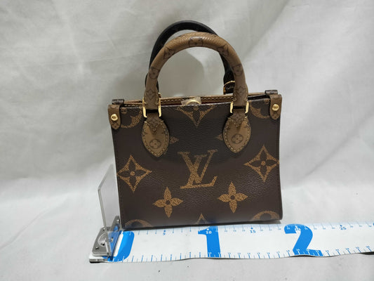 LOUIS VUITTON Monogram LOUIS VUITTON On the Go PM Tourtrell Creme Two-Tone Monogram Empreinte Leather Handbag