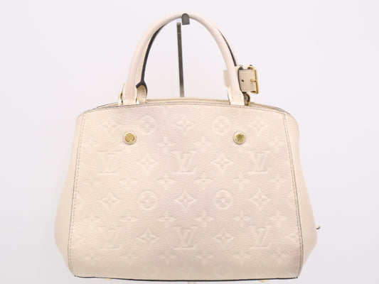 LOUIS VUITTON M50880 Empreinte Montaigne BB White Handbag with Shoulder Strap, Padlock, Two Keys, Cloche, and Poignier Closure