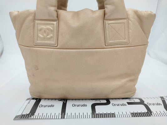 CHANEL Coco Cocoon Hand Leather Gold Handbag