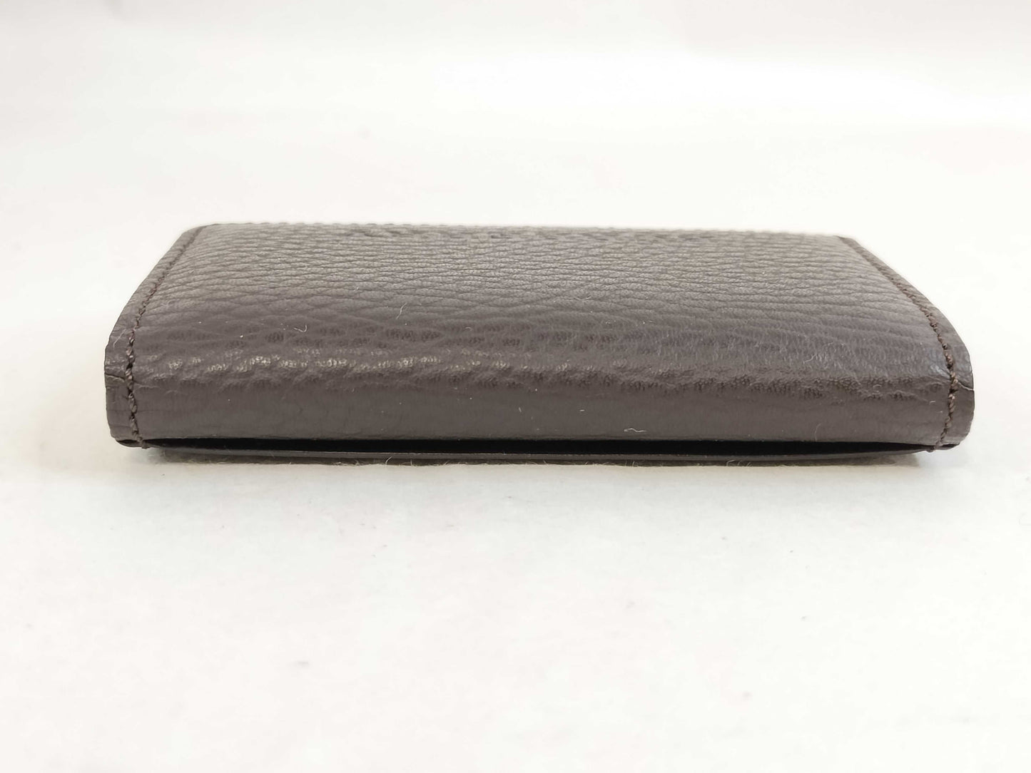 BURBERRY 18. Two Burberry clutches and a second bag