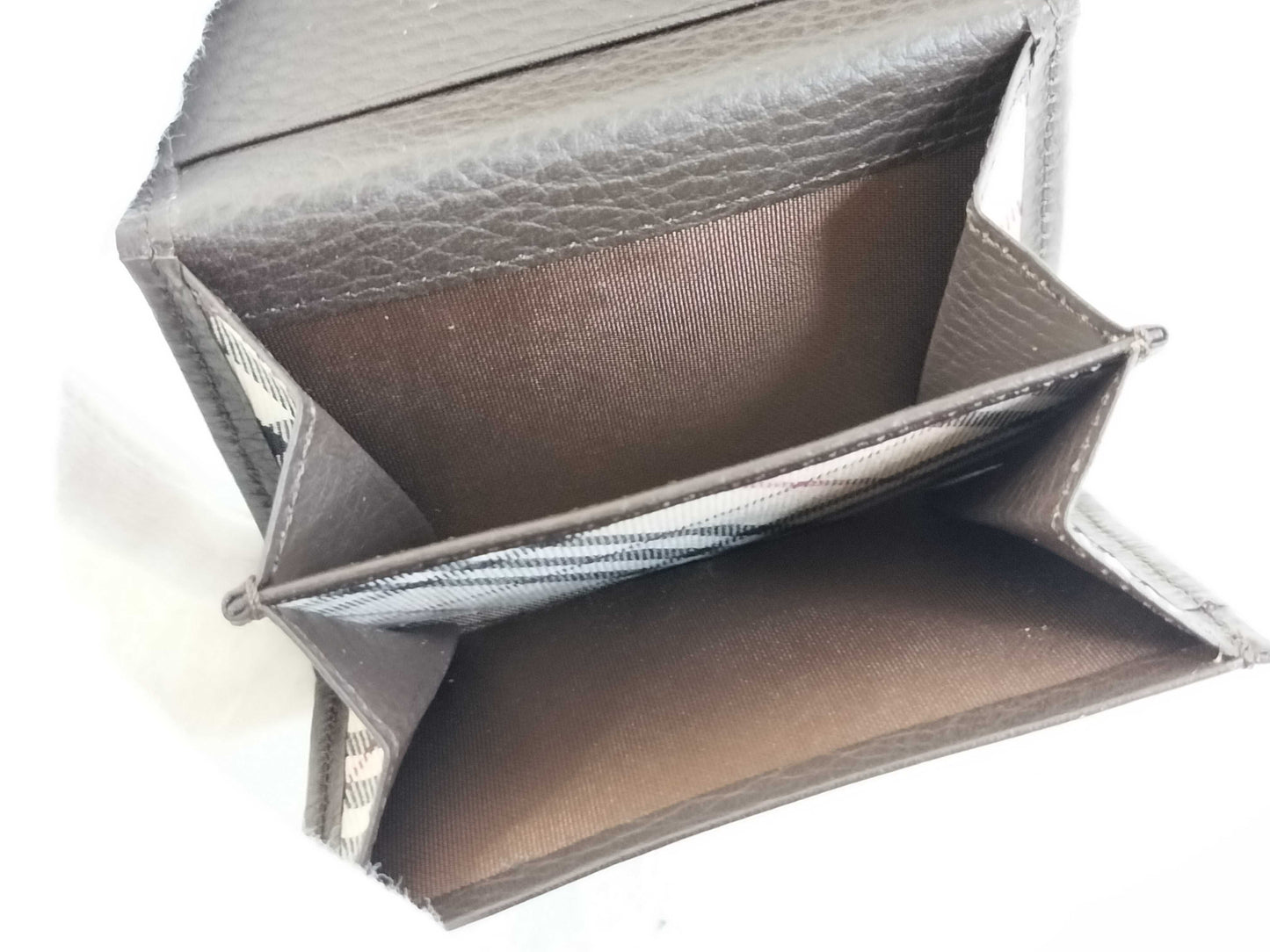 BURBERRY 18. Two Burberry clutches and a second bag