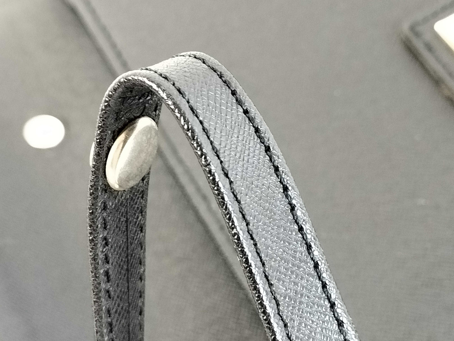 BURBERRY 18. Two Burberry clutches and a second bag