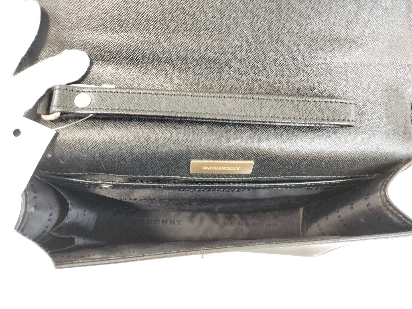 BURBERRY 18. Two Burberry clutches and a second bag