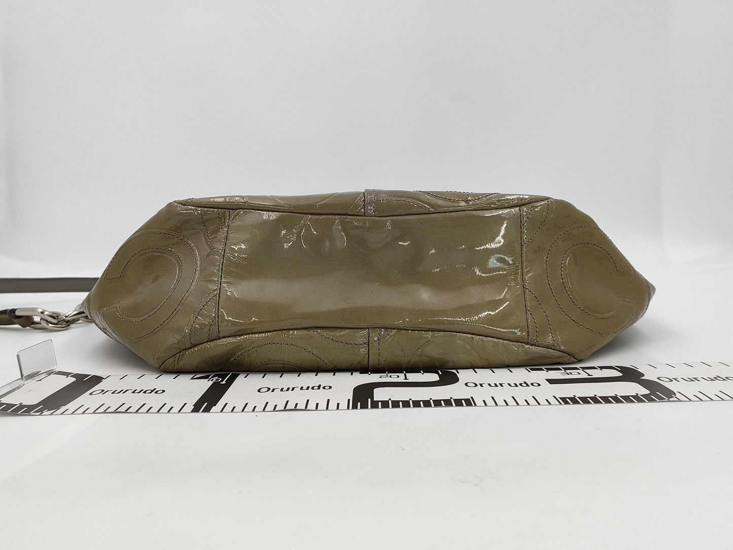 Five beautifully-fitted shoulder bags, including COACH Michael Kors.