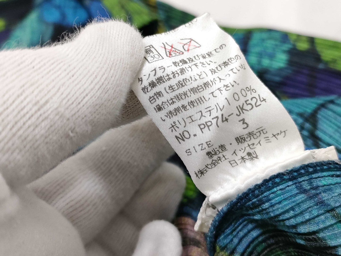 ISSEY MIYAKE Pleated Top with Patterned Buttons