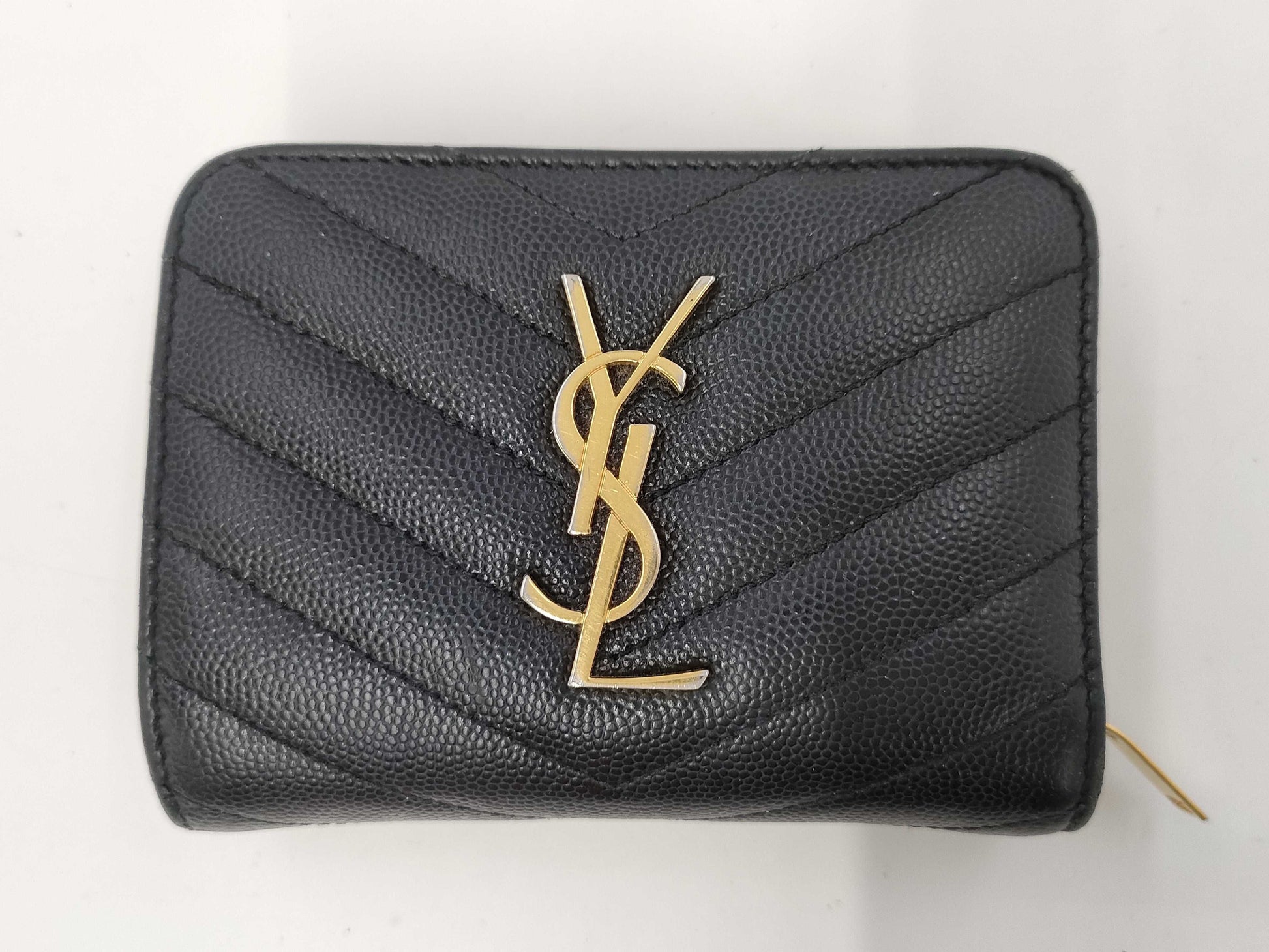 Yves Saint Laurent Bifold Wallet with Caviar, Gold Hardware, Logo, and a Tear