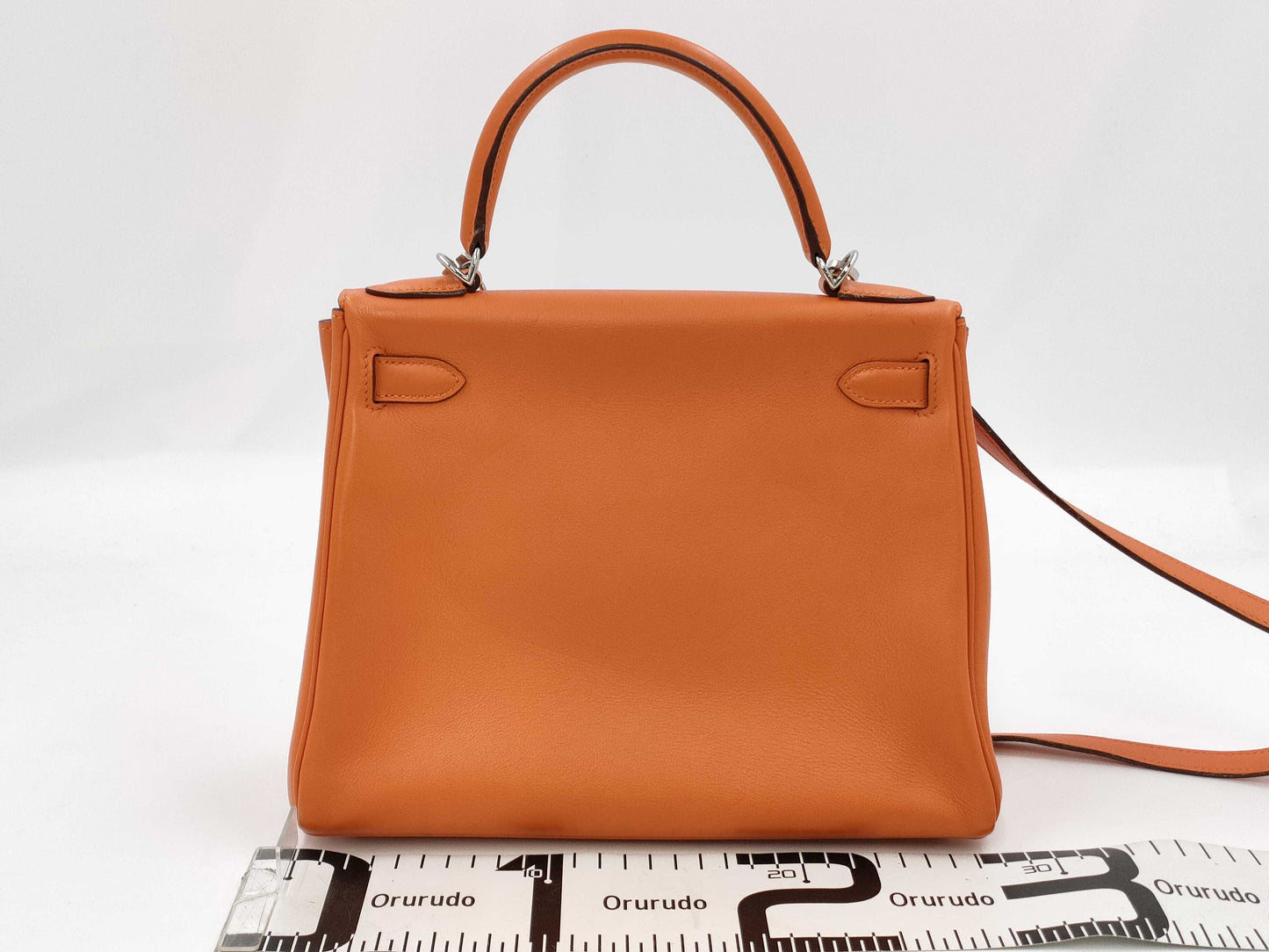HERMES Kelly 28 handbag with silver hardware, inner stitching, orange Taurillon leather, K stamped.