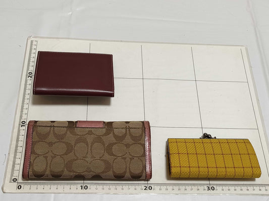 5-piece wallet set including COACH and Cartier