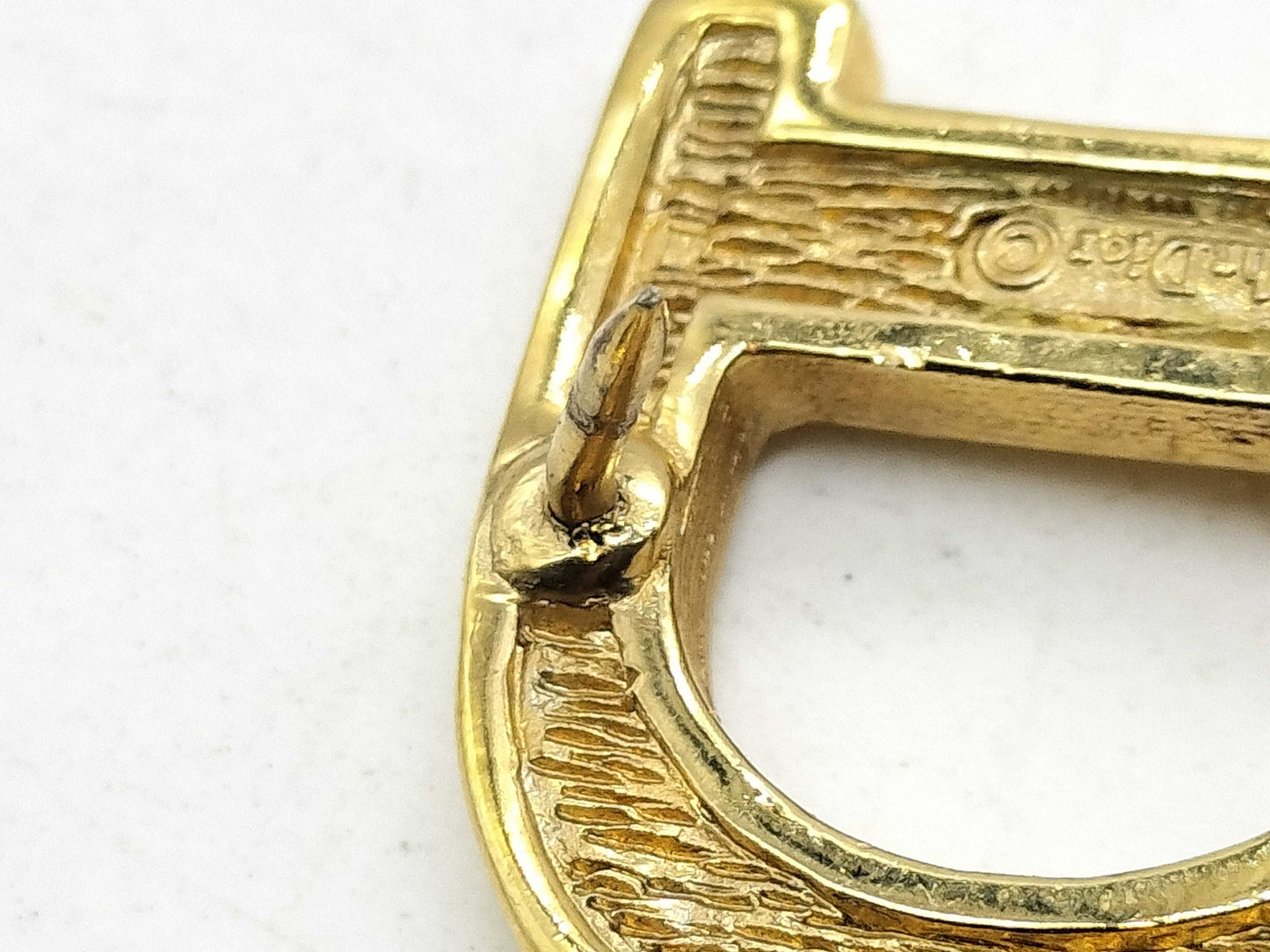 Dior logo brooch