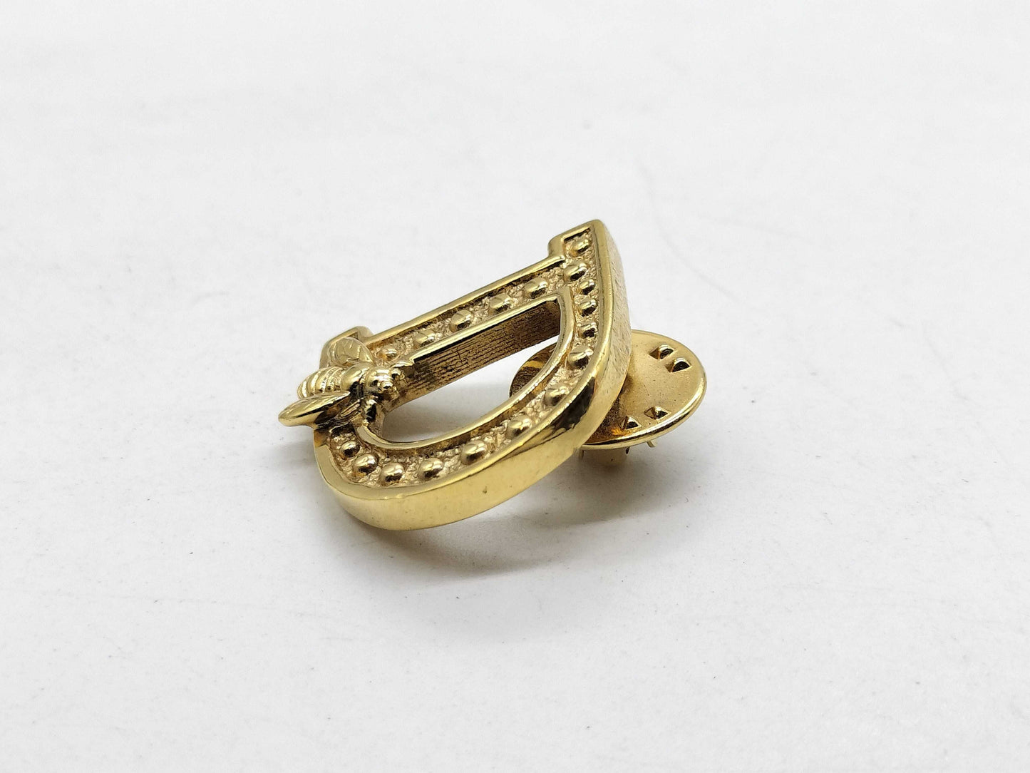 Dior logo brooch