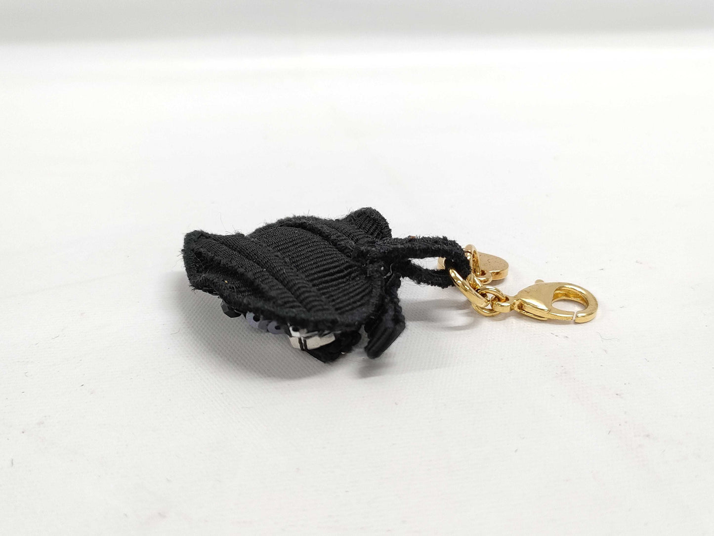 PRADA Charms and other accessories