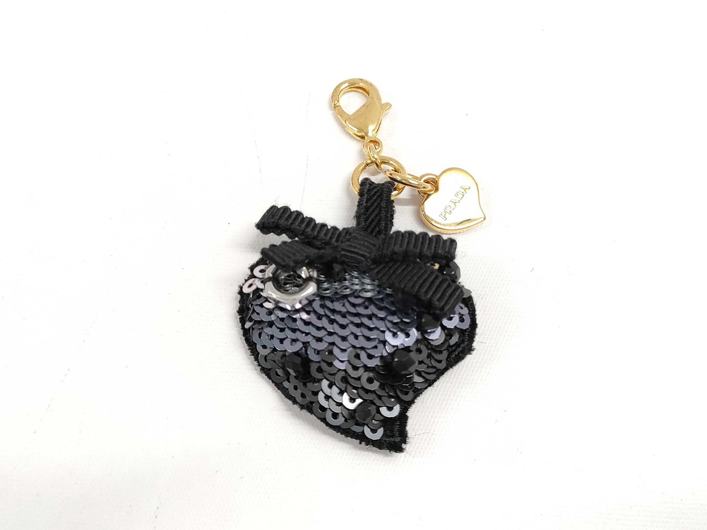PRADA Charms and other accessories