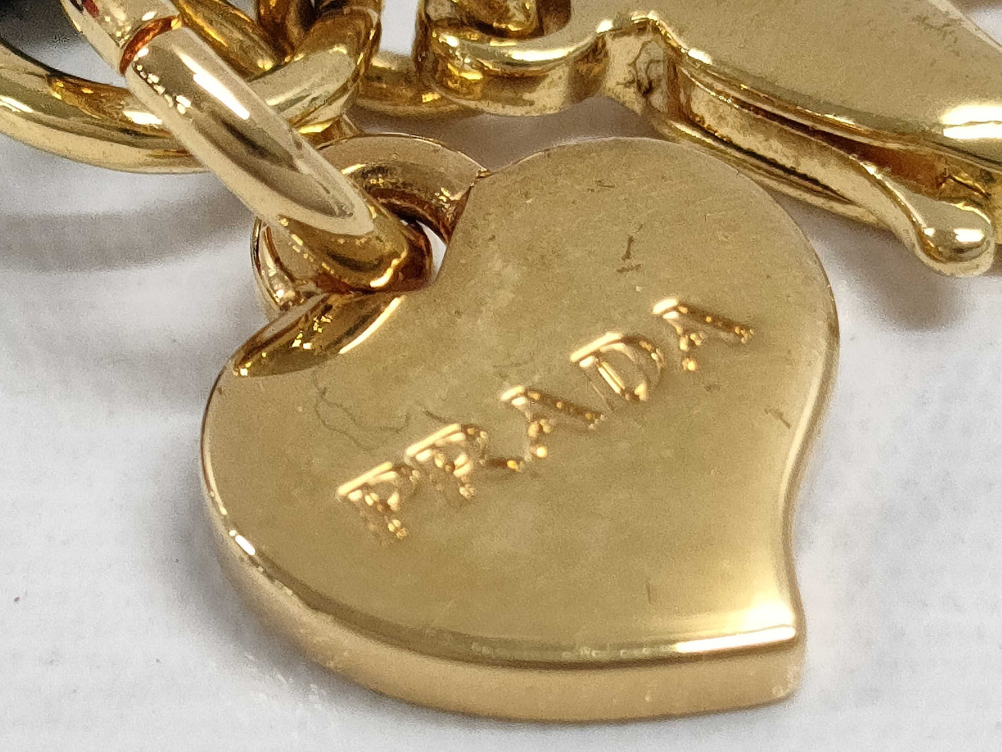 PRADA Charms and other accessories