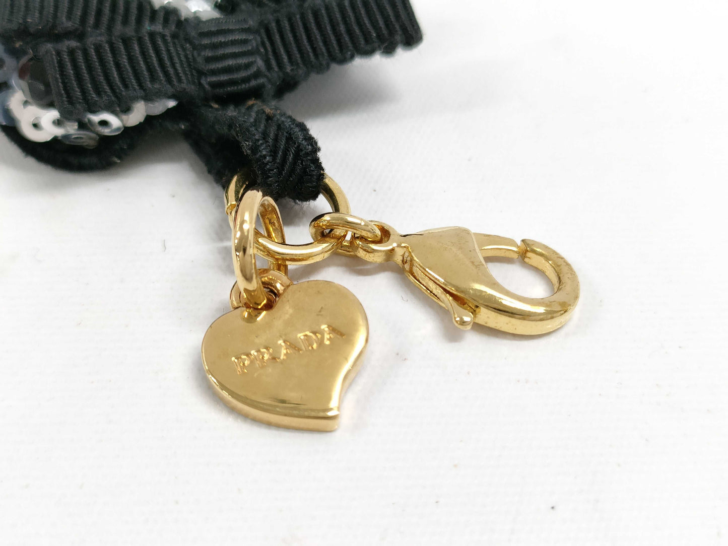 PRADA Charms and other accessories