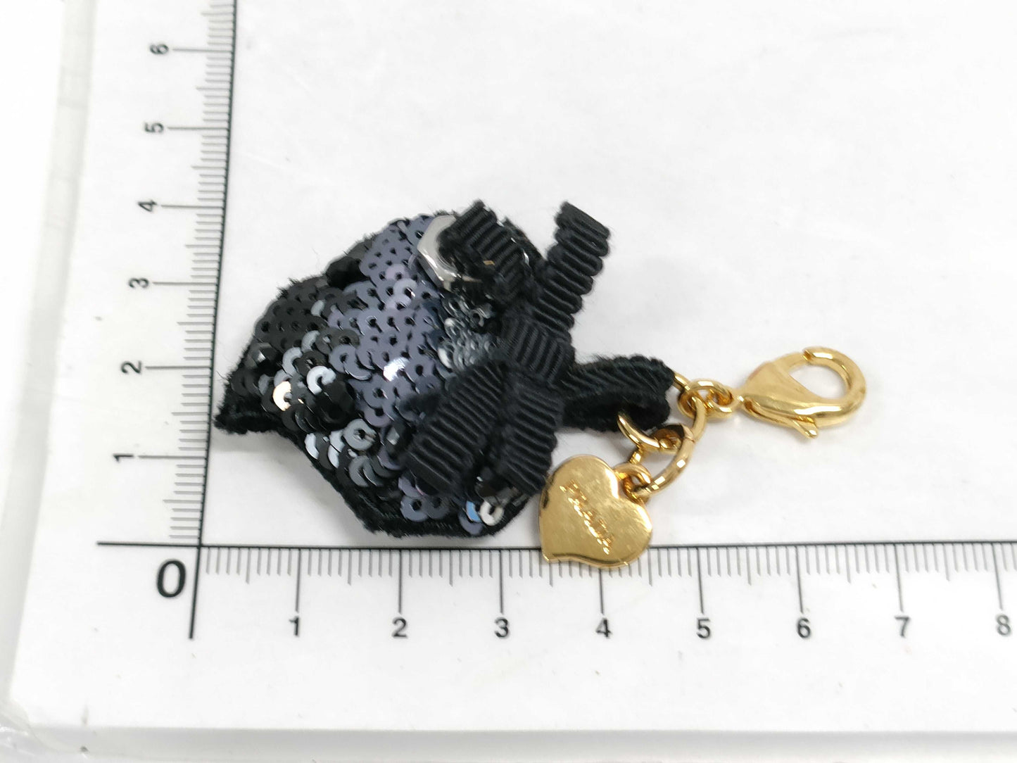 PRADA Charms and other accessories