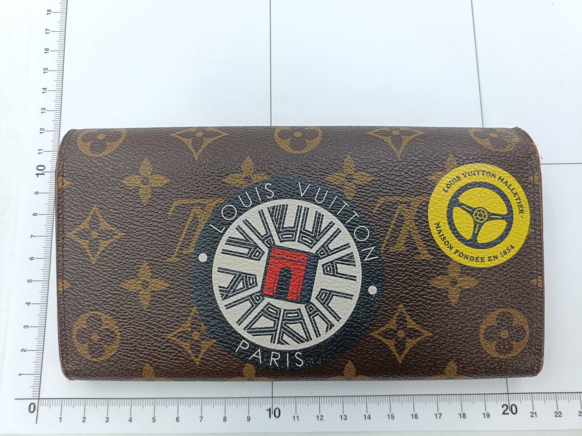 LOUIS VUITTON Monogram World Tour Portefeuille Sarah Wallet with Initials